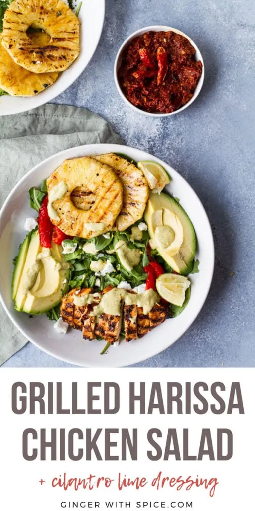 Large white bowl with salad ingredients like grilled pineapple and chicken. Pinterest pin.