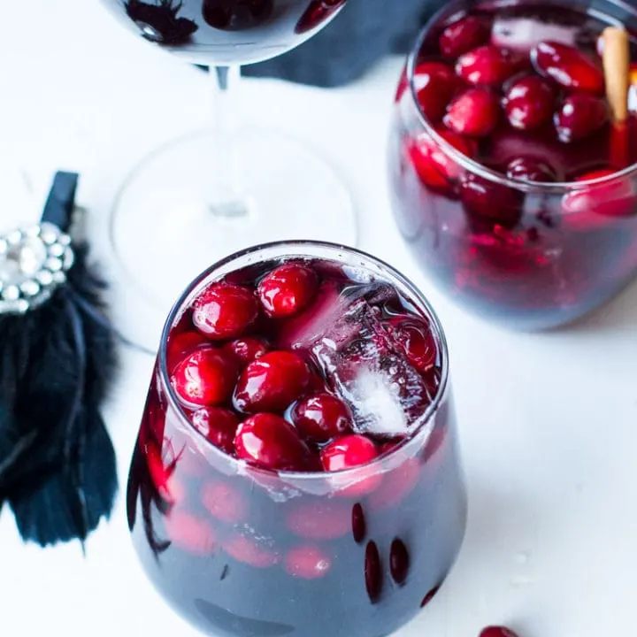 Wine glasses with fresh cranberries.