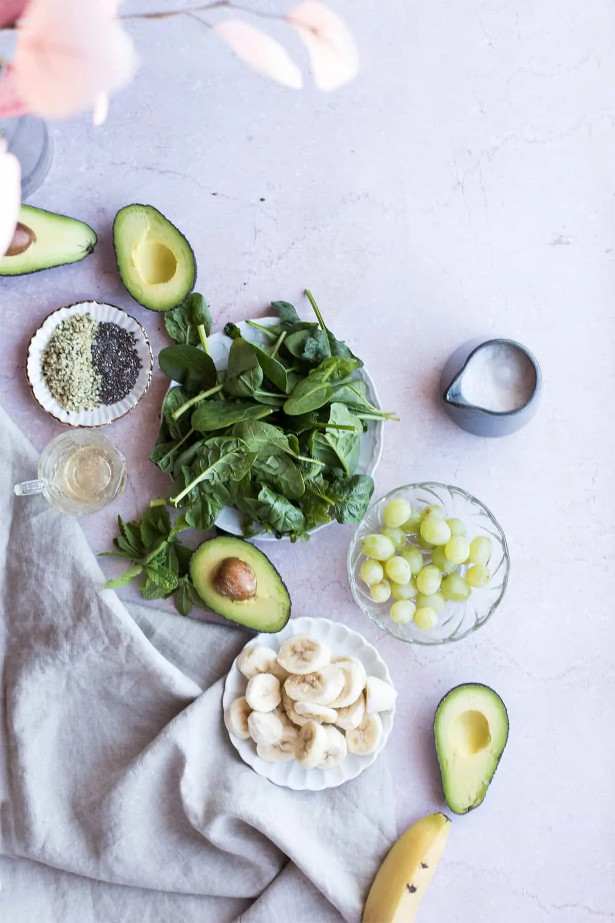 Ingredients to make the green smoothie with grape.