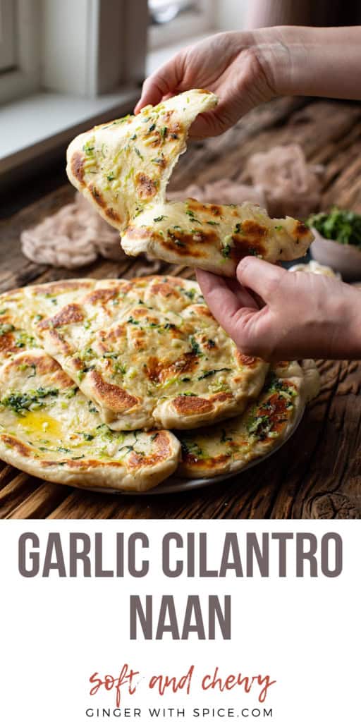 Hands tearing a piece of cilantro naan. Title text at the bottom, Pinterest pin.