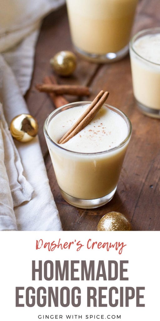 A glass with homemade eggnog with a cinnamon stick floating on the foam. Pinterest pin.