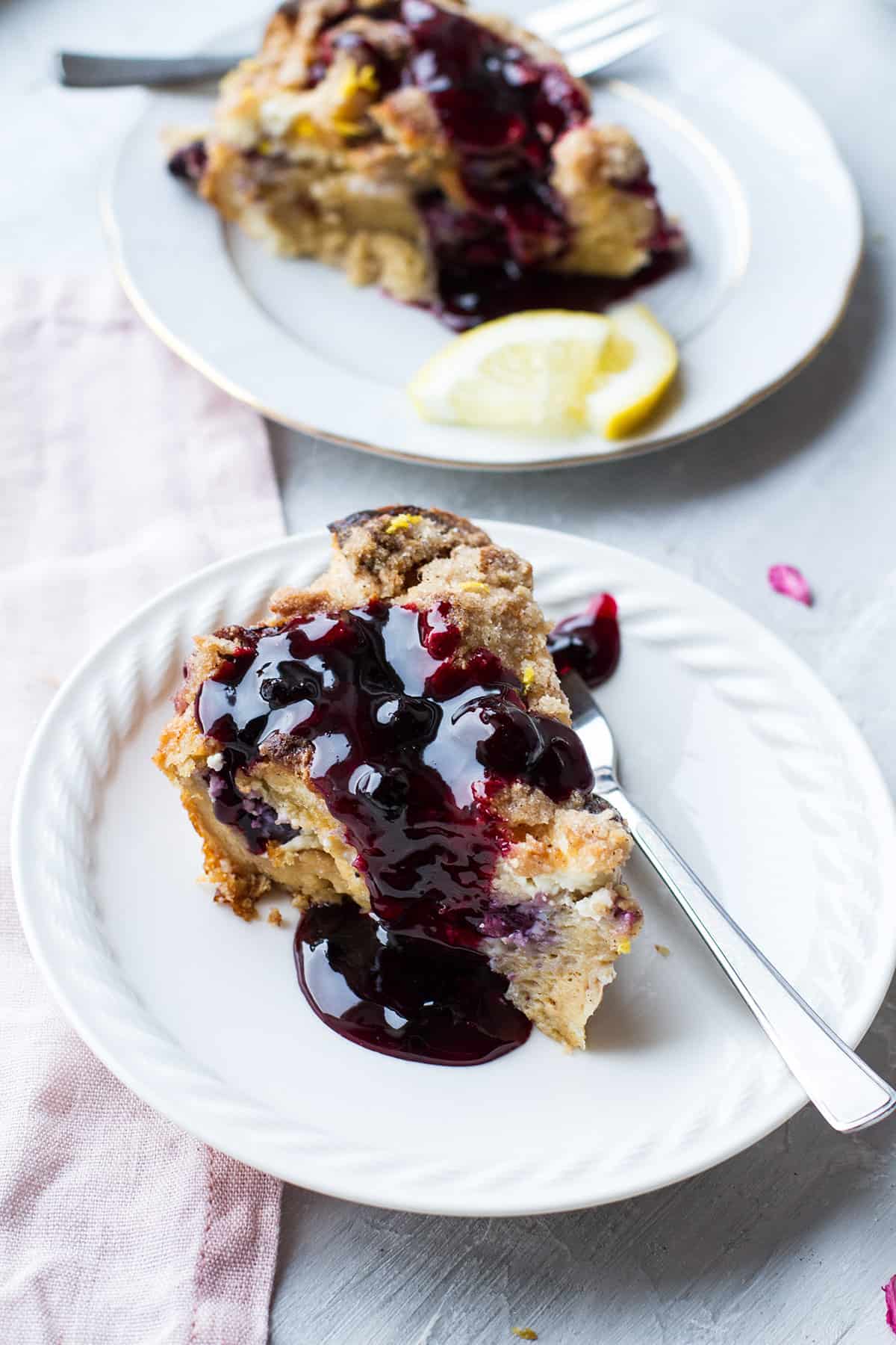 Slice of blueberry French toast topped with blueberry sauce.