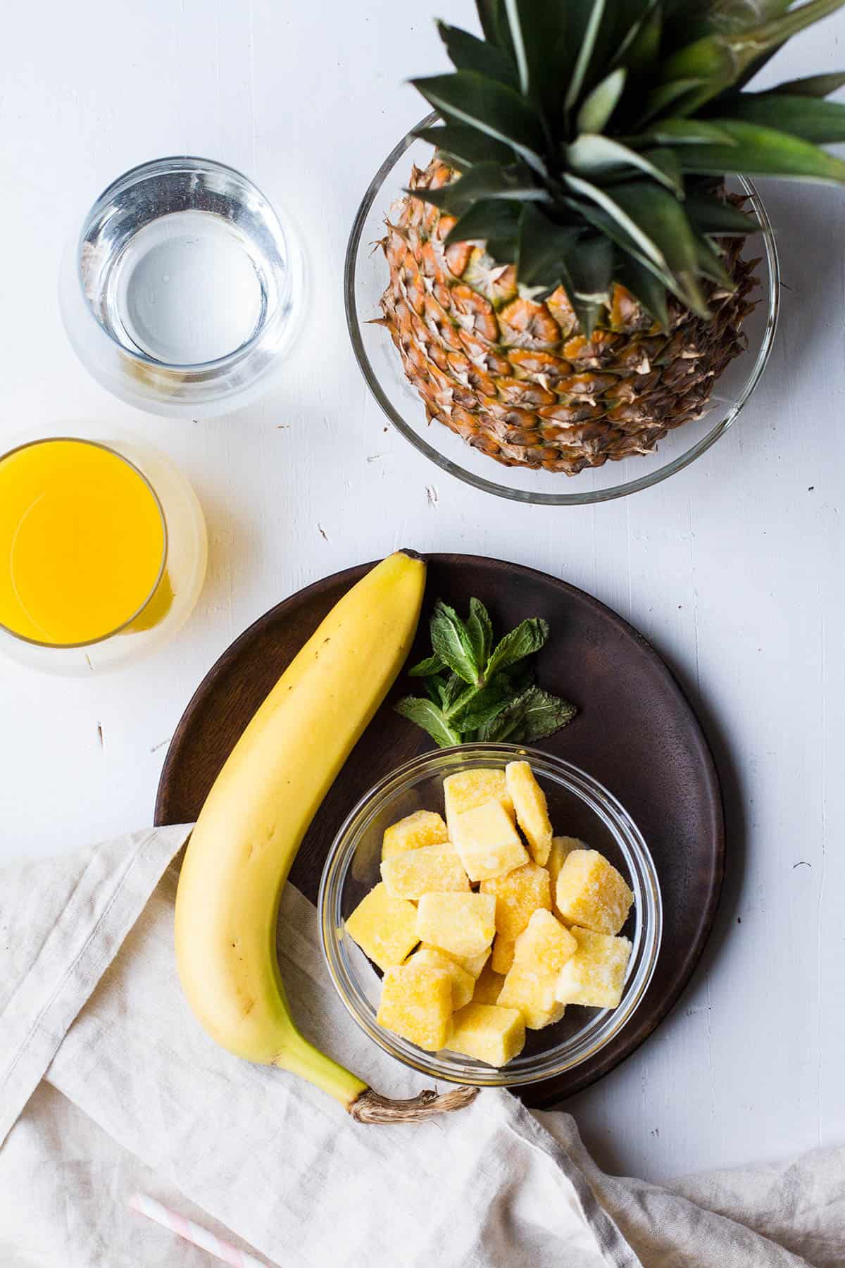 Ingredients to make mango pineapple smoothie.