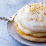 Close up of the soft cake with rum cream oozing out the sides.