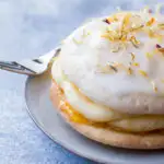 Close up of the soft cake with rum cream oozing out the sides.