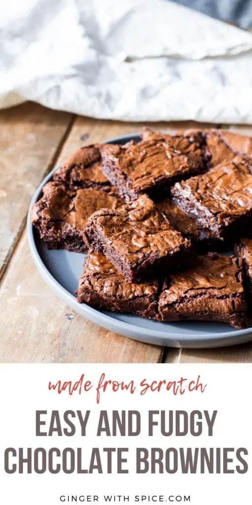 Stacks of brownies on a large plate. Pinterest pin.