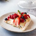 Pavlova recipe square photo of sliced pavlova cake.