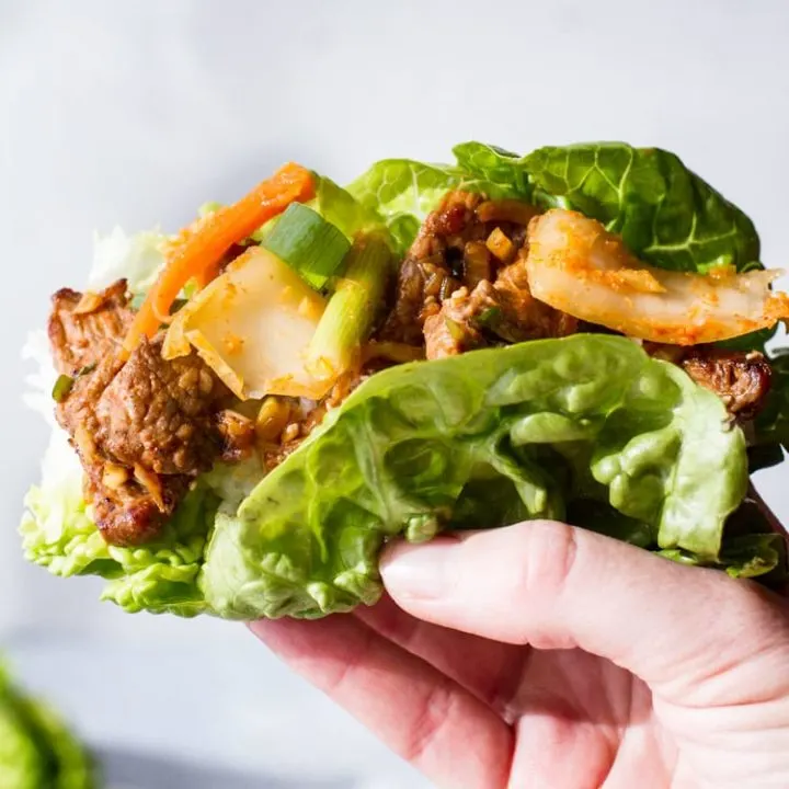 Beef bulgogi lettuce wrap with kimchi. Square photo.