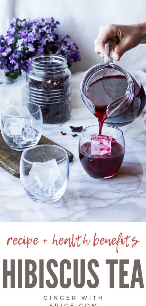 Pouring hibiscus tea into one of three glasses. Dried hibiscus in a mason jar in the background. Pinterest pin.