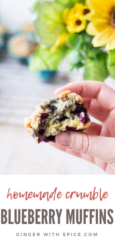 Hand holding an open homemade blueberry muffin. Pinterest pin.