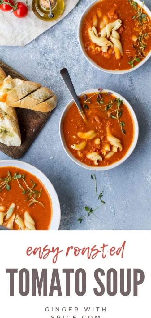 Three bowls of roasted tomato soup, garnished with pasta and fresh thyme. Pinterest pin.