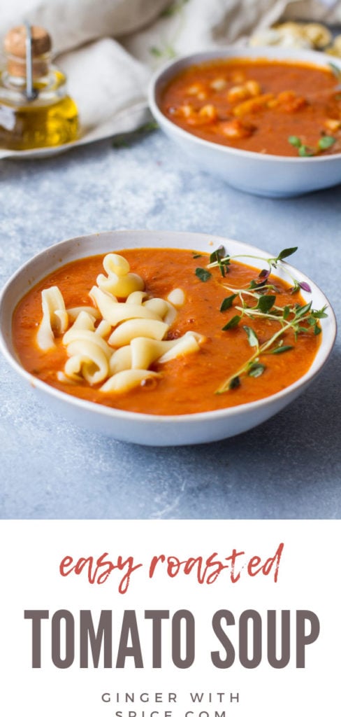 Two bowls of roasted tomato soup, pasta and fresh thyme sprig. Pinterest pin.