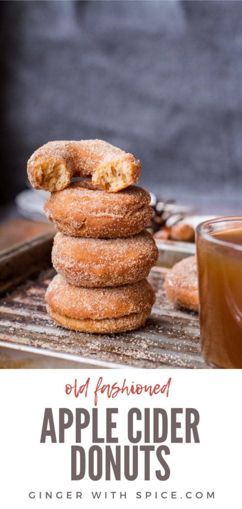 A stack of three apple cider donuts and one half on top. Pinterest pin.