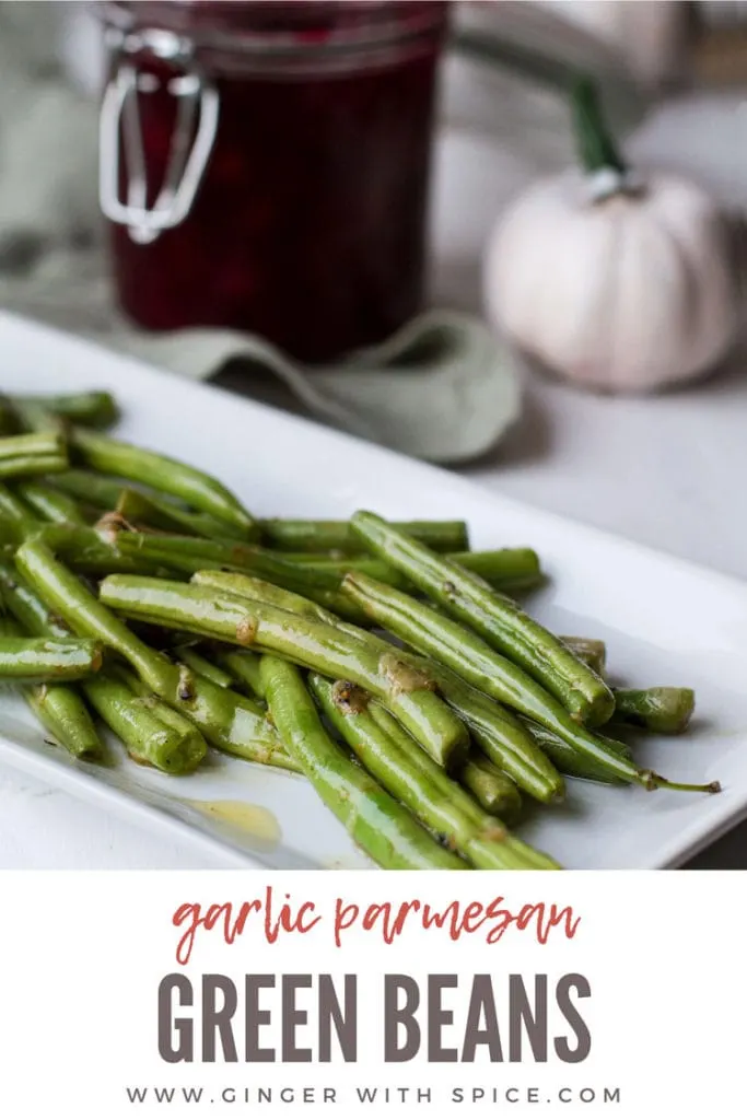 Sauteed green beans on a white, rectangular plate. Pinterest pin with text overlay.