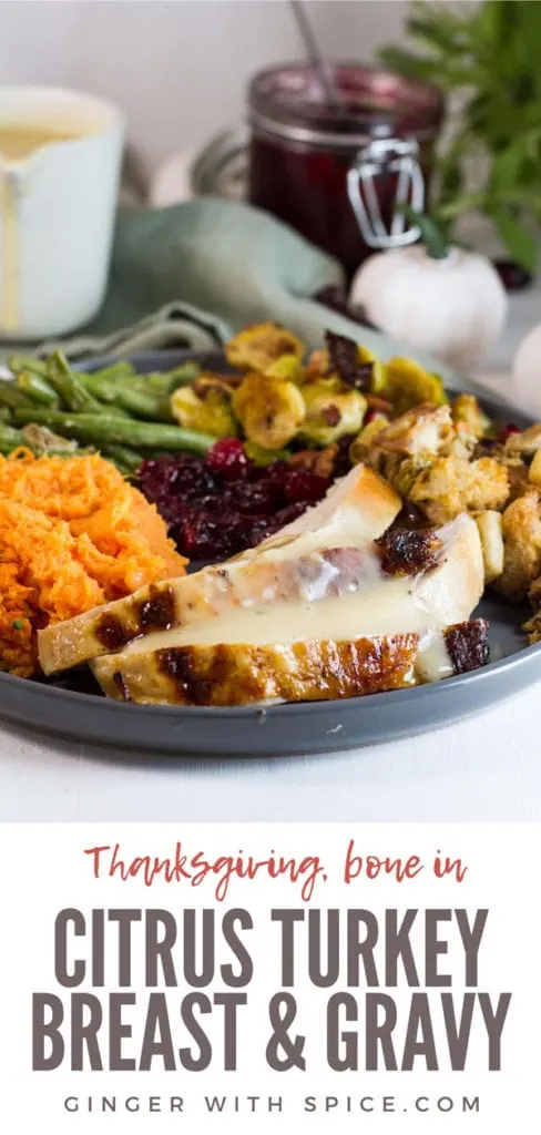 Complete Thanksgiving meal with sliced turkey breast and gravy. Pinterest pin.