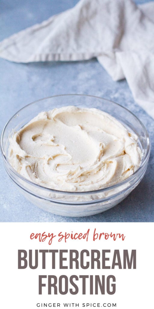 Spiced Brown Buttercream Frosting in a glass bowl, blue background. Pinterest pin.