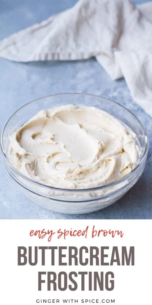 Spiced Brown Buttercream Frosting in a glass bowl, blue background. Pinterest pin.