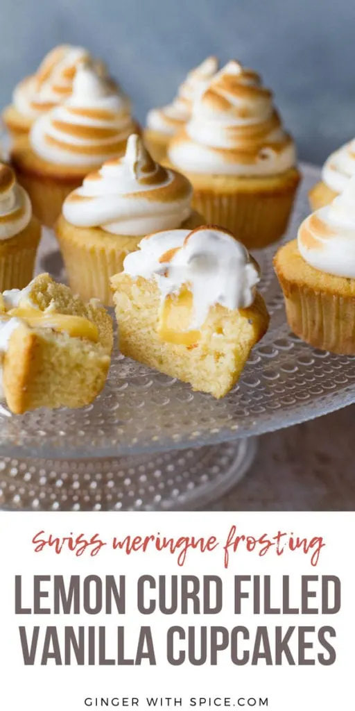 Cupcakes on a glass cake stand, with torched Swiss meringue. One cut open to show lemon curd. Pinterest pin with text.