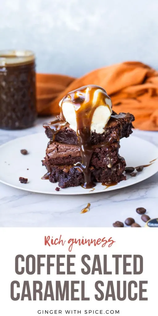 Three Guinness caramel brownies squares stacked, melting ice cream scoop on top with a lot of caramel sauce. Pinterest pin.