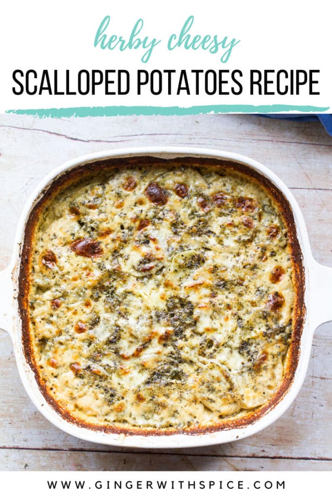 White casserole with scalloped potatoes and a cheesy top. Blue linen on the side. Pinterest pin with text overlay: Scalloped Potatoes Recipe.