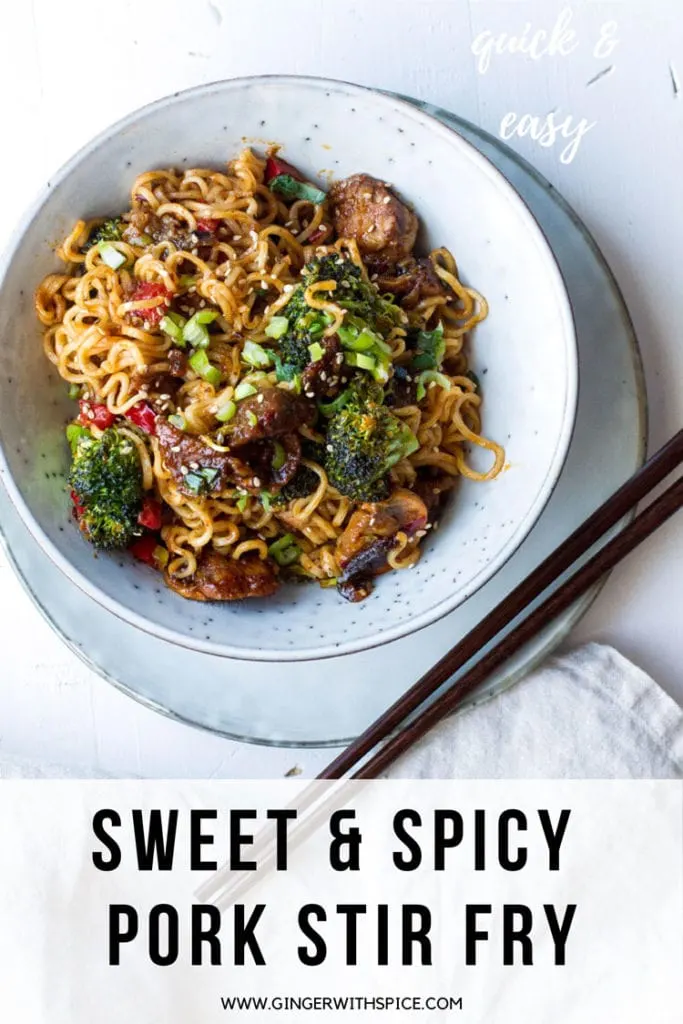Bowl with pork stir fry and noodles. Chopsticks on the side. Pinterest pin.