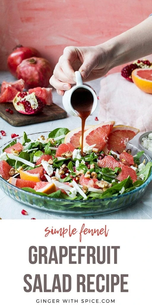 Long Pinterest pin with text overlay at the bottom. Hand pouring pomegranate vinaigrette over grapefruit salad.