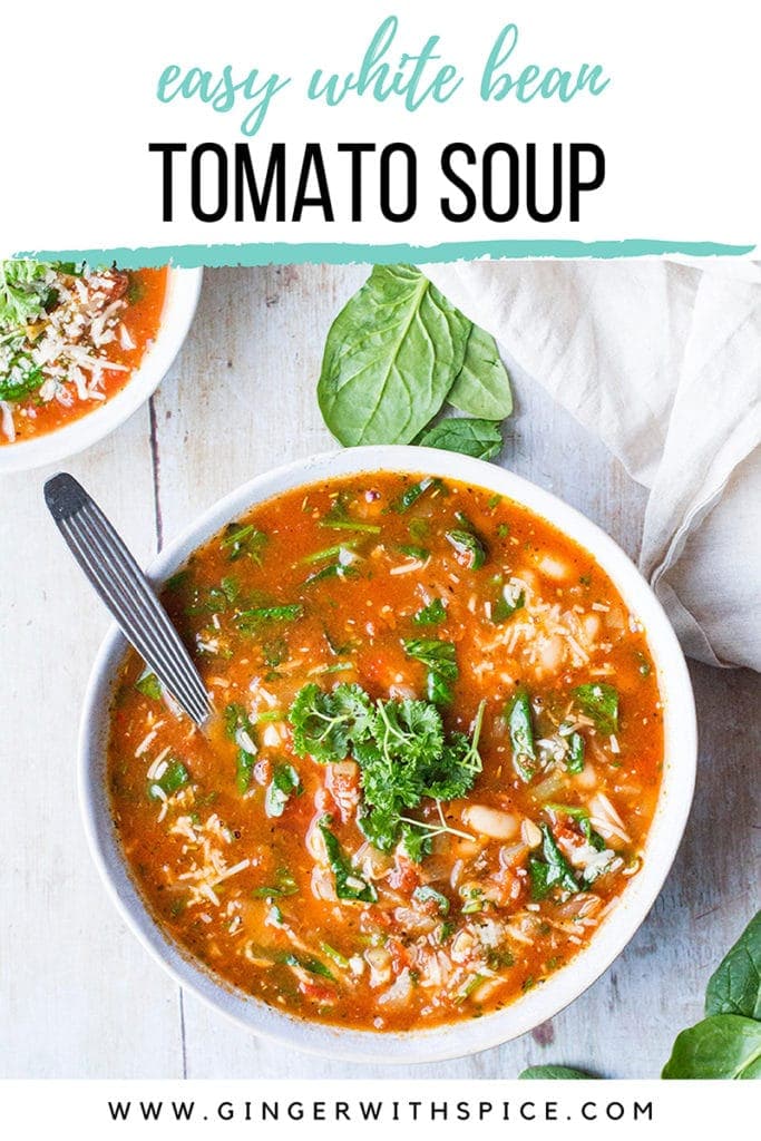Tomato white bean soup in a large white bowl, garnished with parsley. Seen from above. Pinterest pin with text at the top.