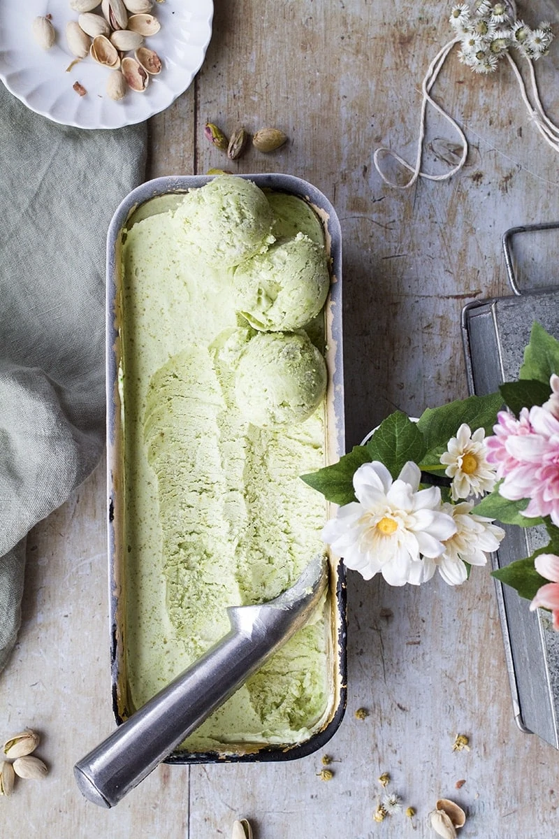 Flatlay of pistachio ice cream in a loaf pan.