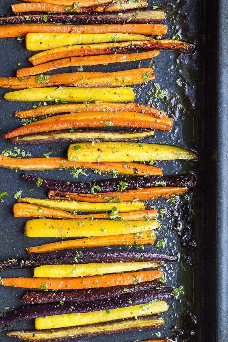 Colorful carrots on a baking sheet.