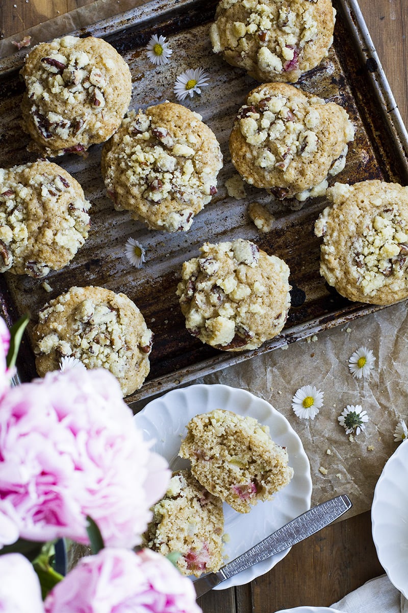 Crumb topping muffins and pink peonies seen from above.