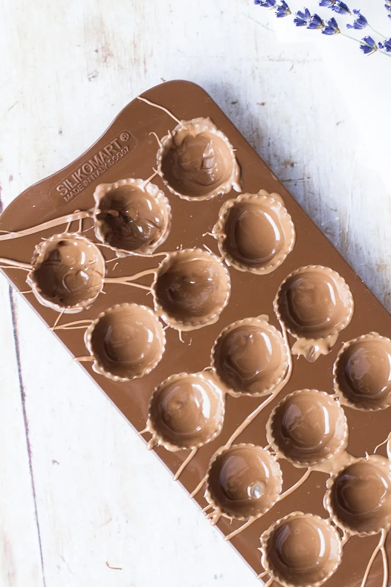 Moulds filled with milk chocolate.