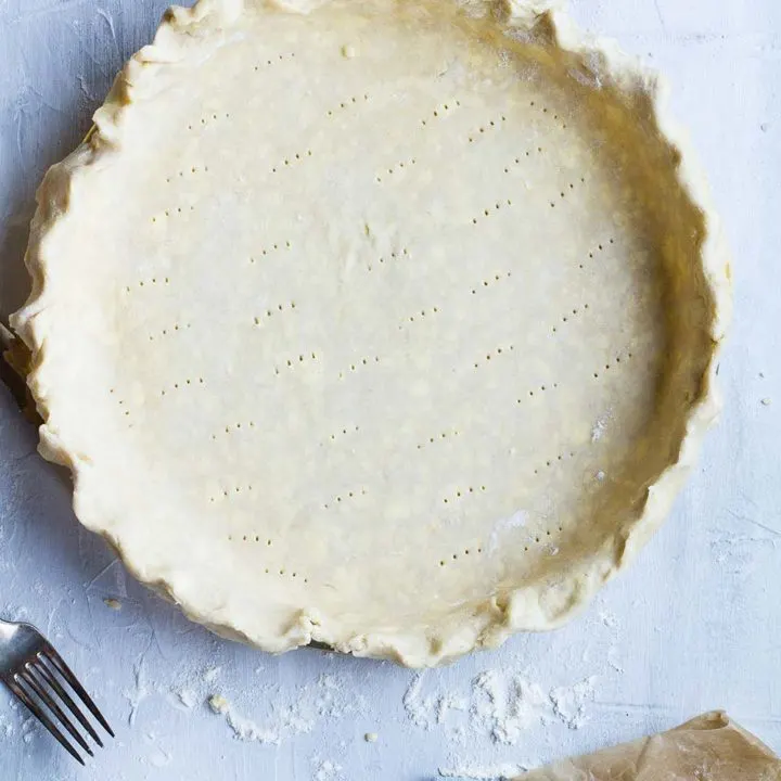 Pie pan filled with an unbaked pie crust.