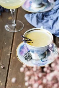 Purple tea cup with honey bee's knees.