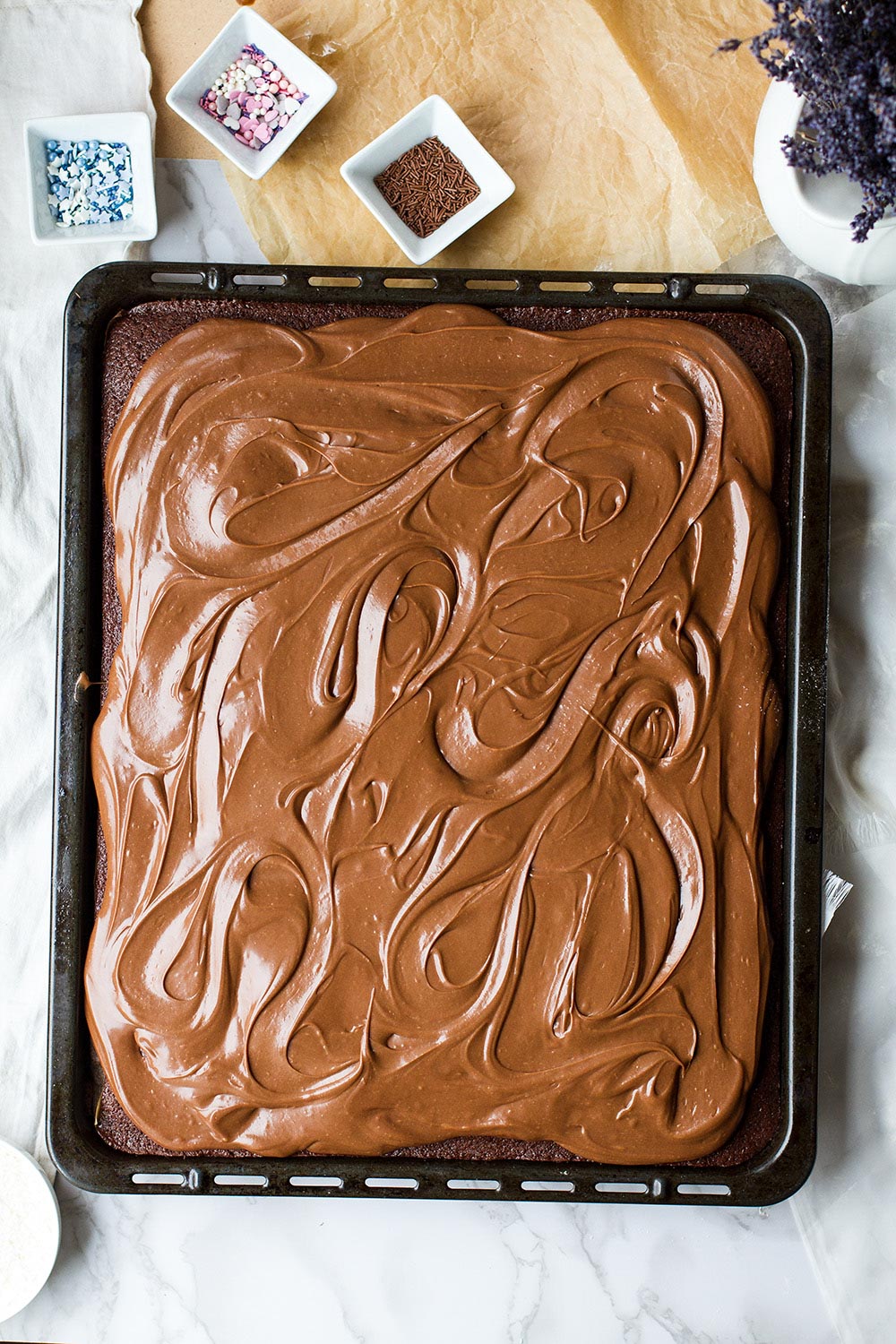 Chocolate cake in a large sheet pan.