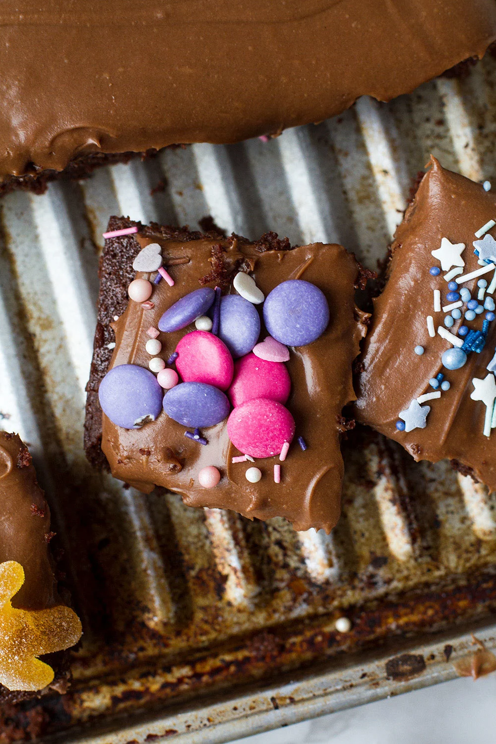 Chocolate cake topped with pink Smarties.