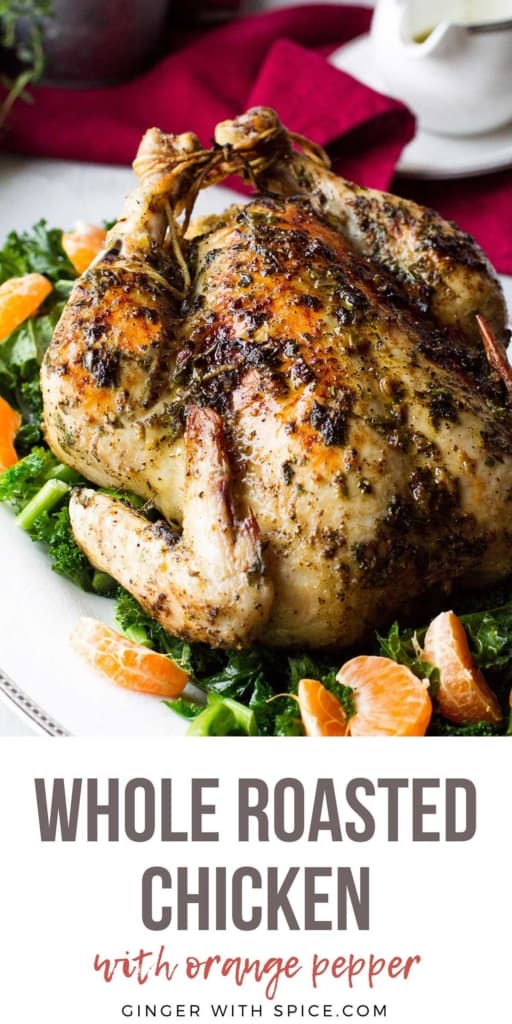 Whole chicken on a plate with kale and clementines. Long Pinterest pin.