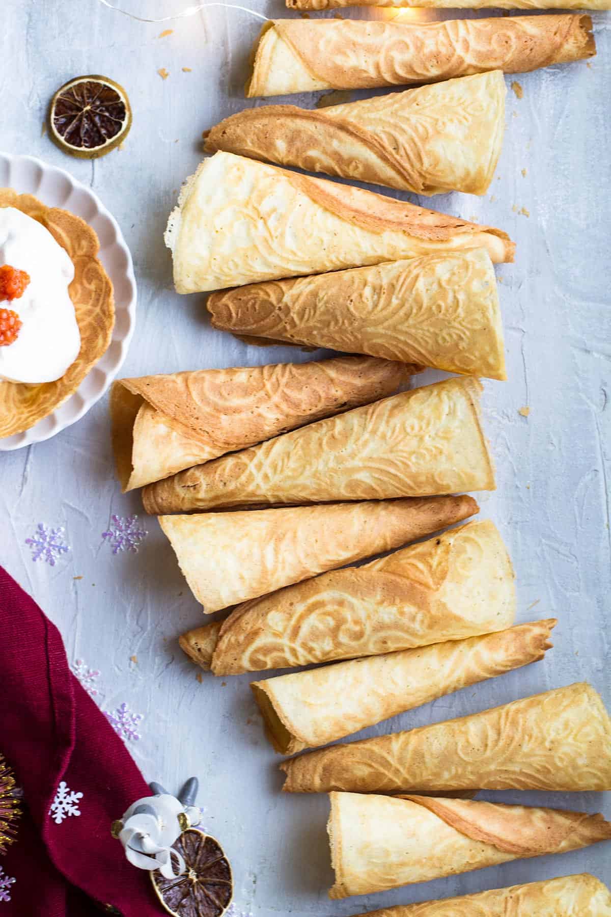 Krumkake cones after each other, creating a ribbon shape.