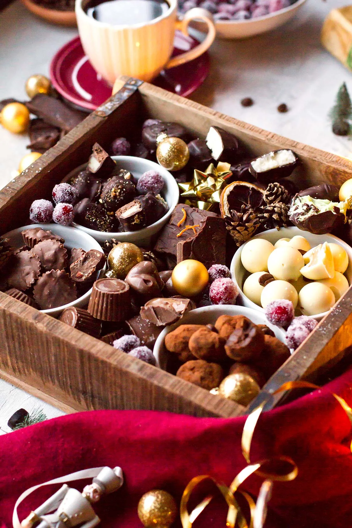 A vintage wooden crate filled with various chocolates.