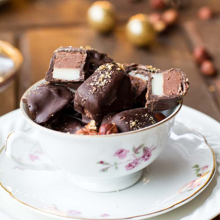 Close-up of the hazelnut nougat pralines in a vintage cup.