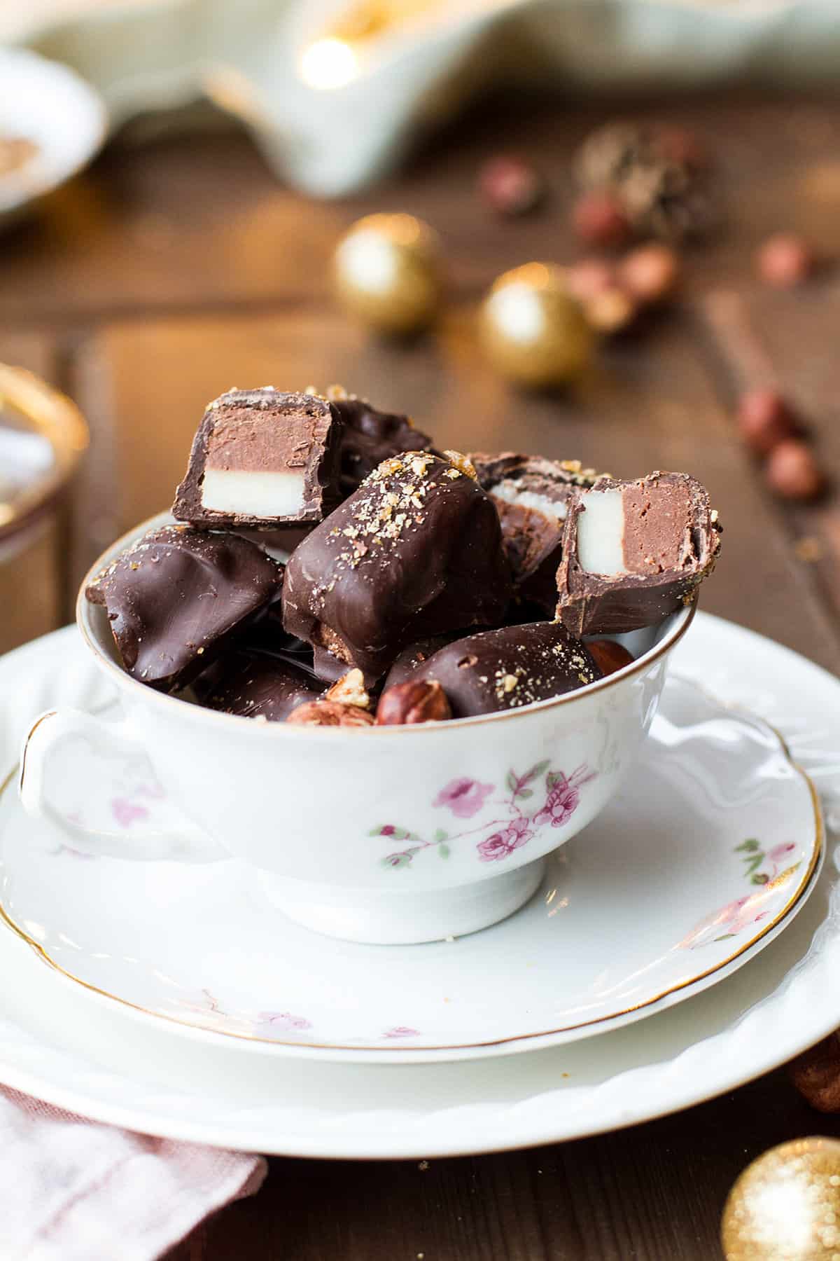 Close-up of the hazelnut nougat pralines in a vintage cup.