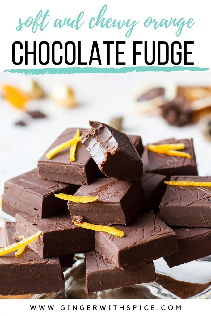 Stack of orange chocolate fudge, one is taken a bite to show the texture. Pinterest pin.