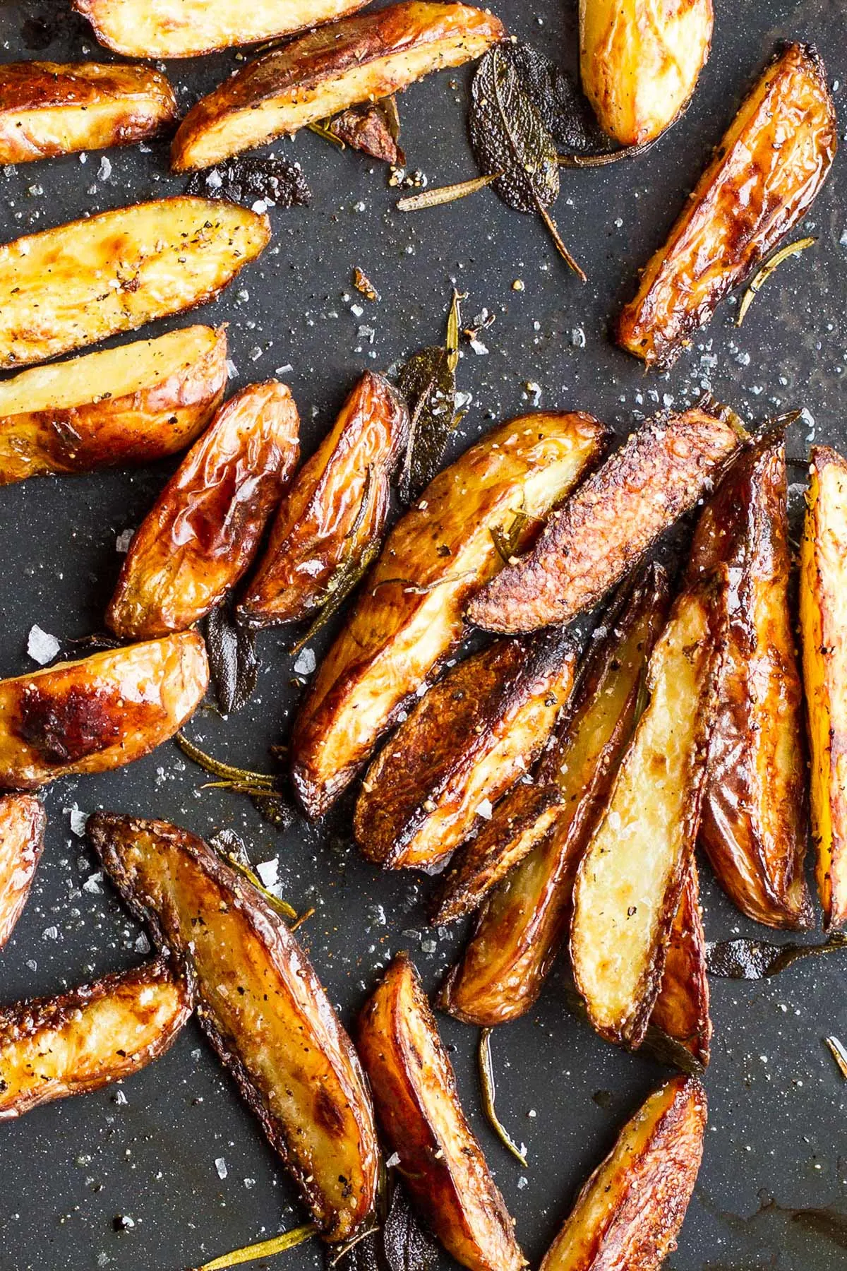 Close-up of the baking tray with crispy potato wedges.