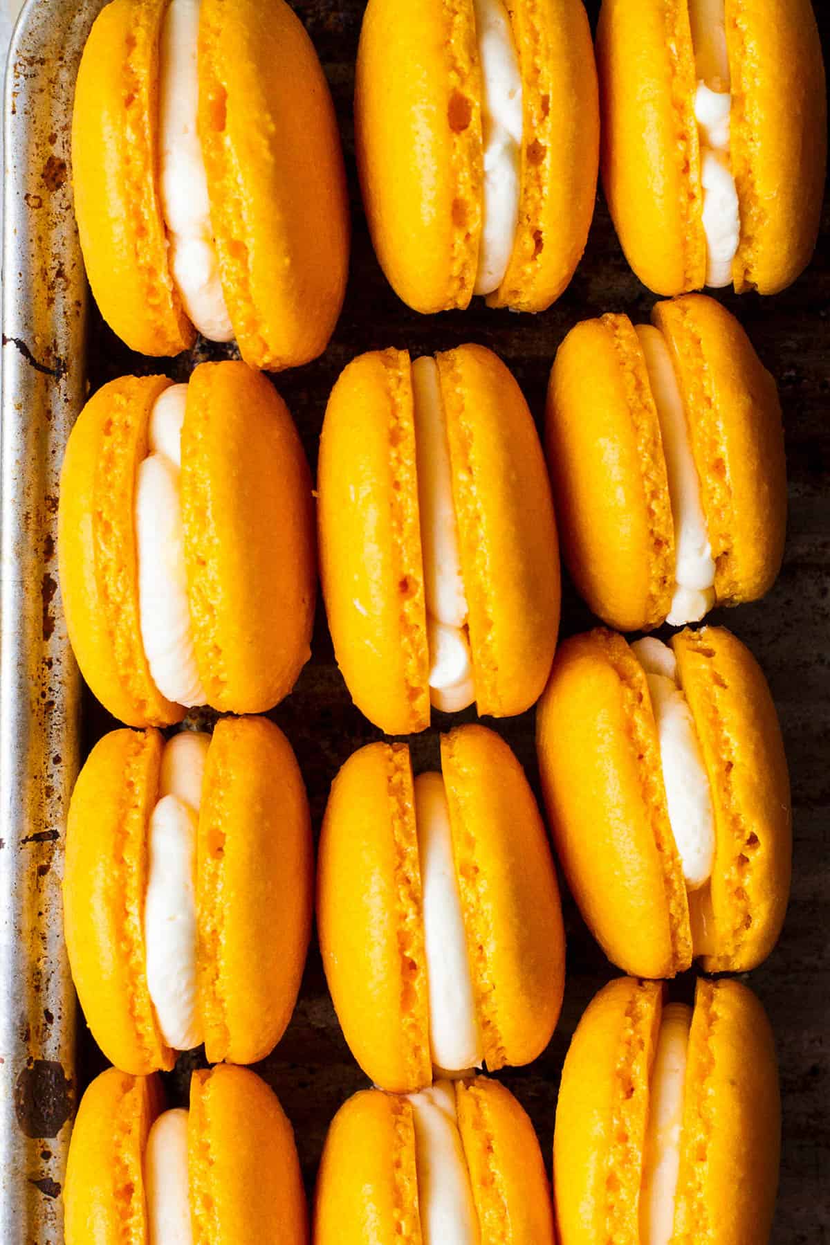 Close-up of sunshine mango macarons.