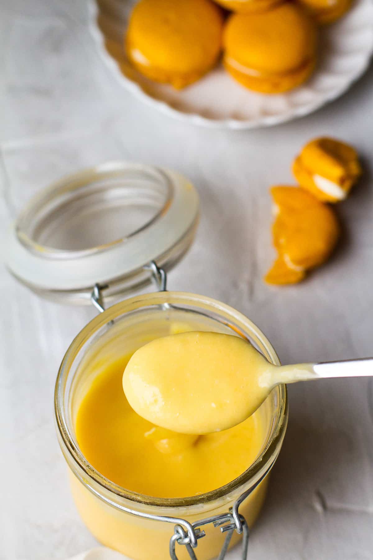 A spoon with lime mango curd.
