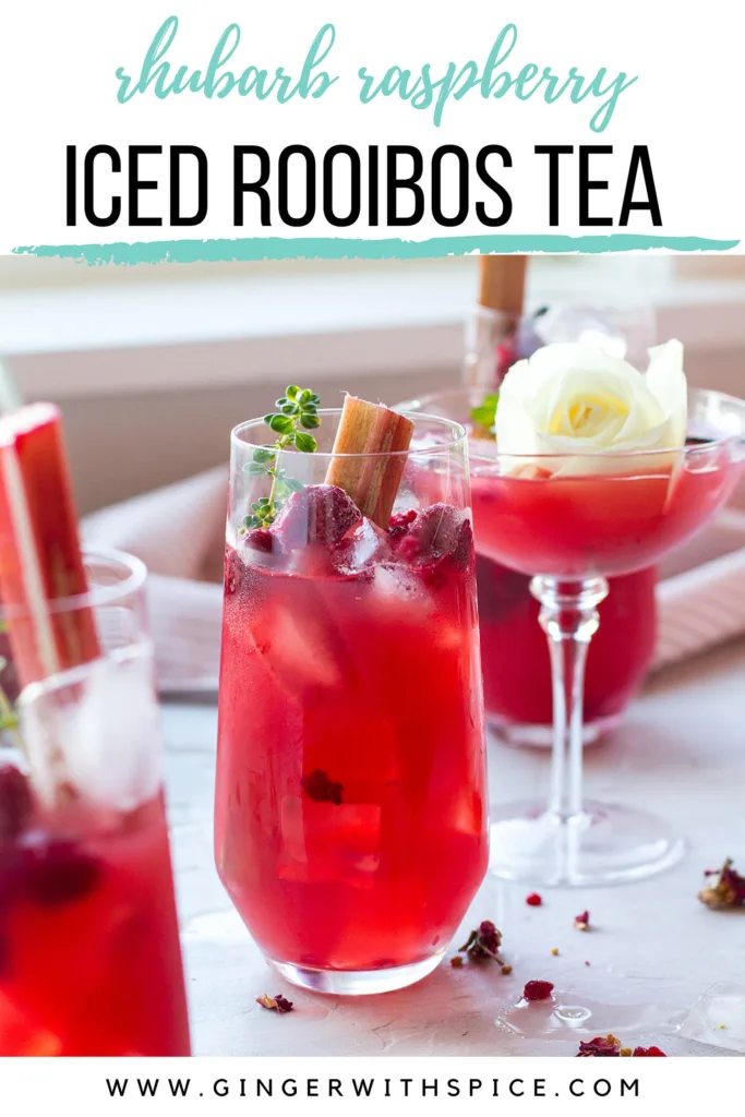 Glasses with red tea and frozen raspberries, text at the top, Pinterest pin.