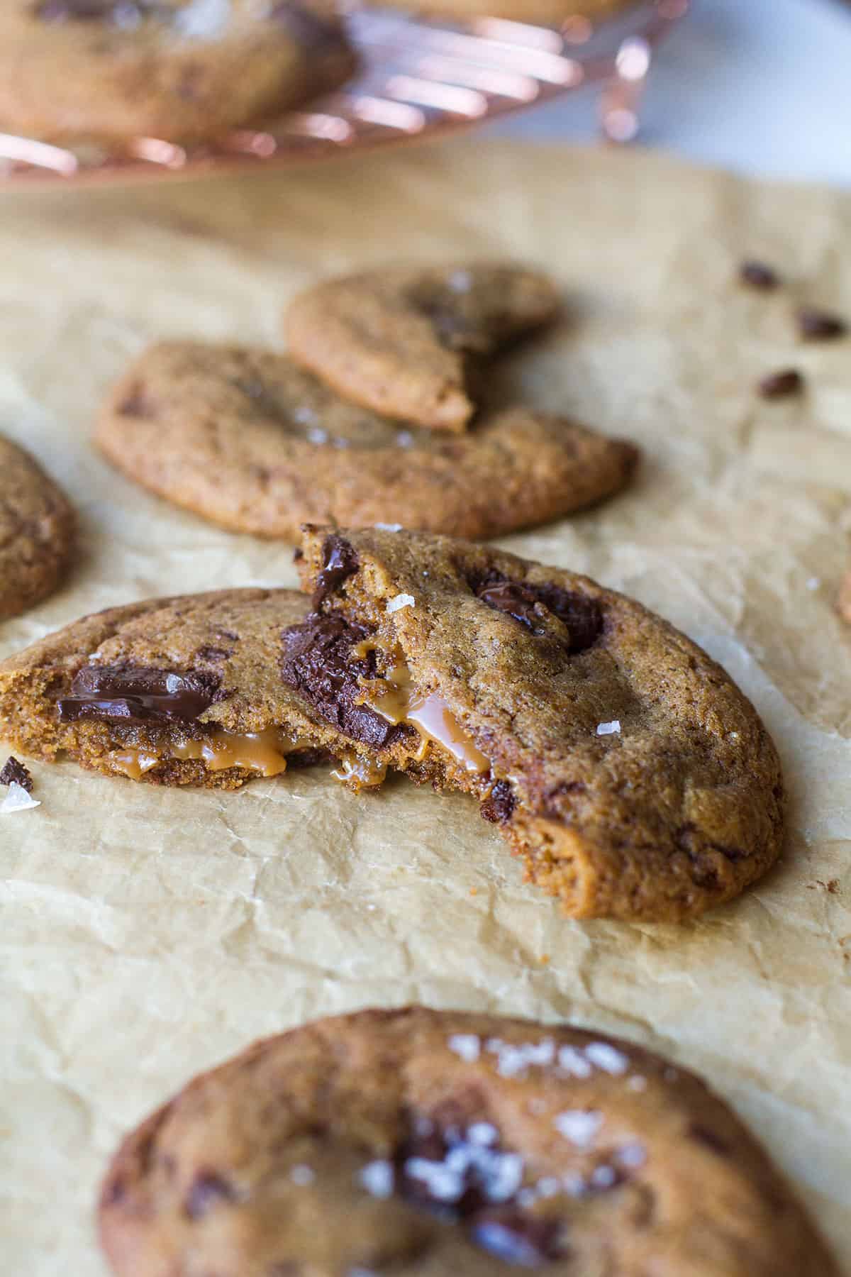A broken cookie to show the salted caramel oozing out.