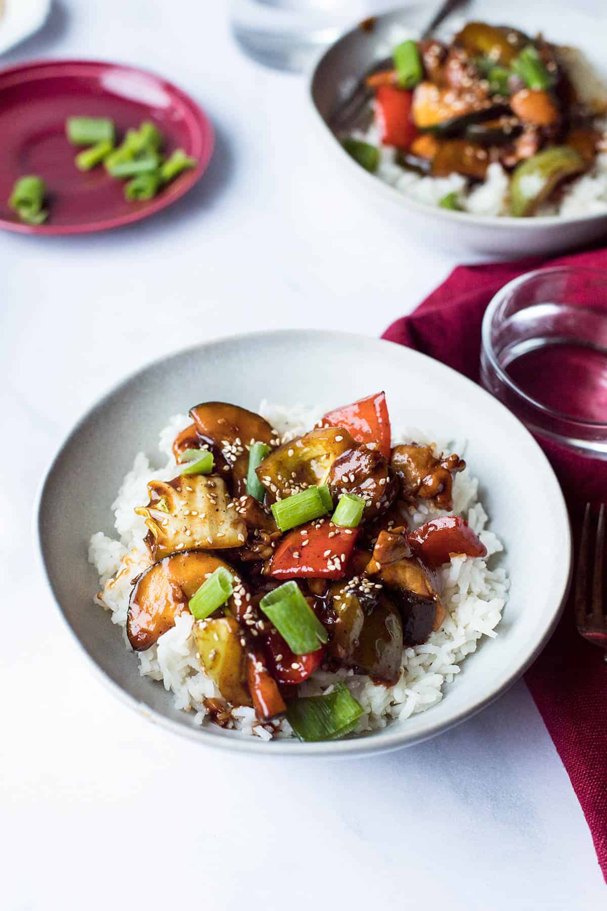 A large bowl with gochujang stir fry and rice.
