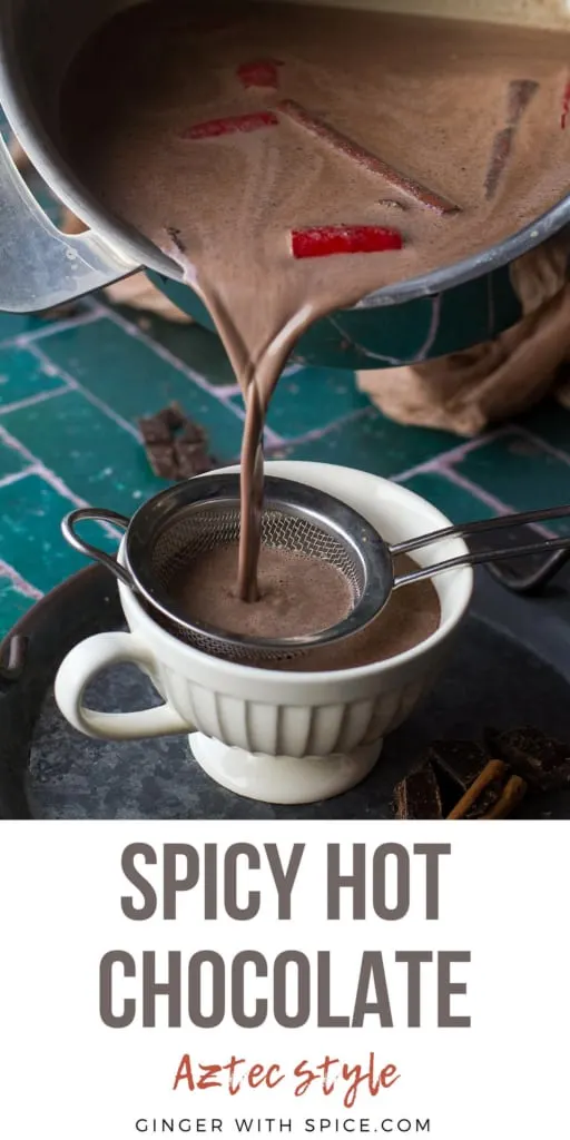Pouring spicy hot chocolate in a small cup, pinterest pin with text at the bottom.