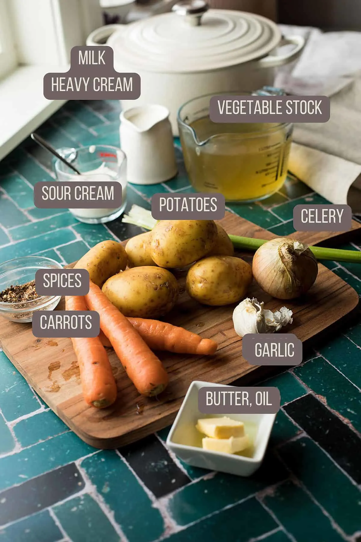 Ingredients to make carrot and potato soup, including text of each ingredient.