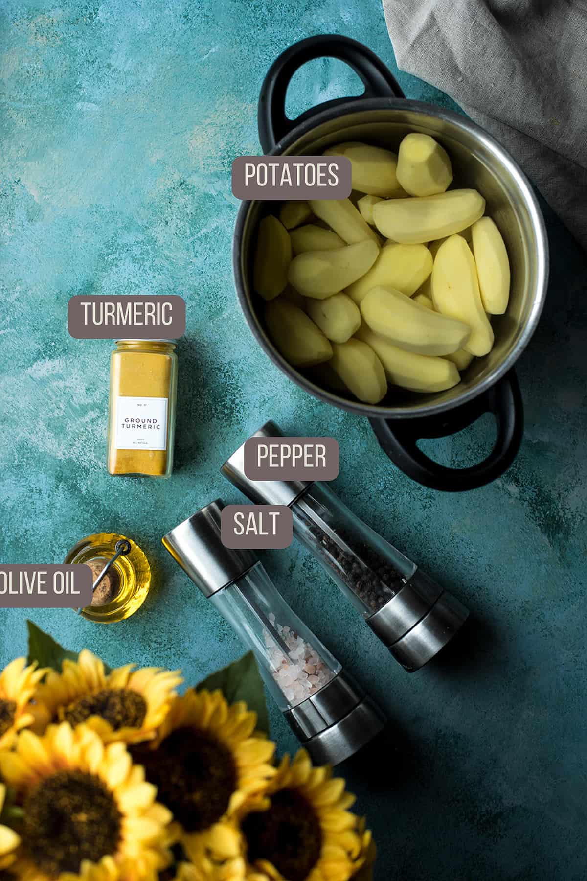 Ingredients to make the potatoes, on a turquoise table.